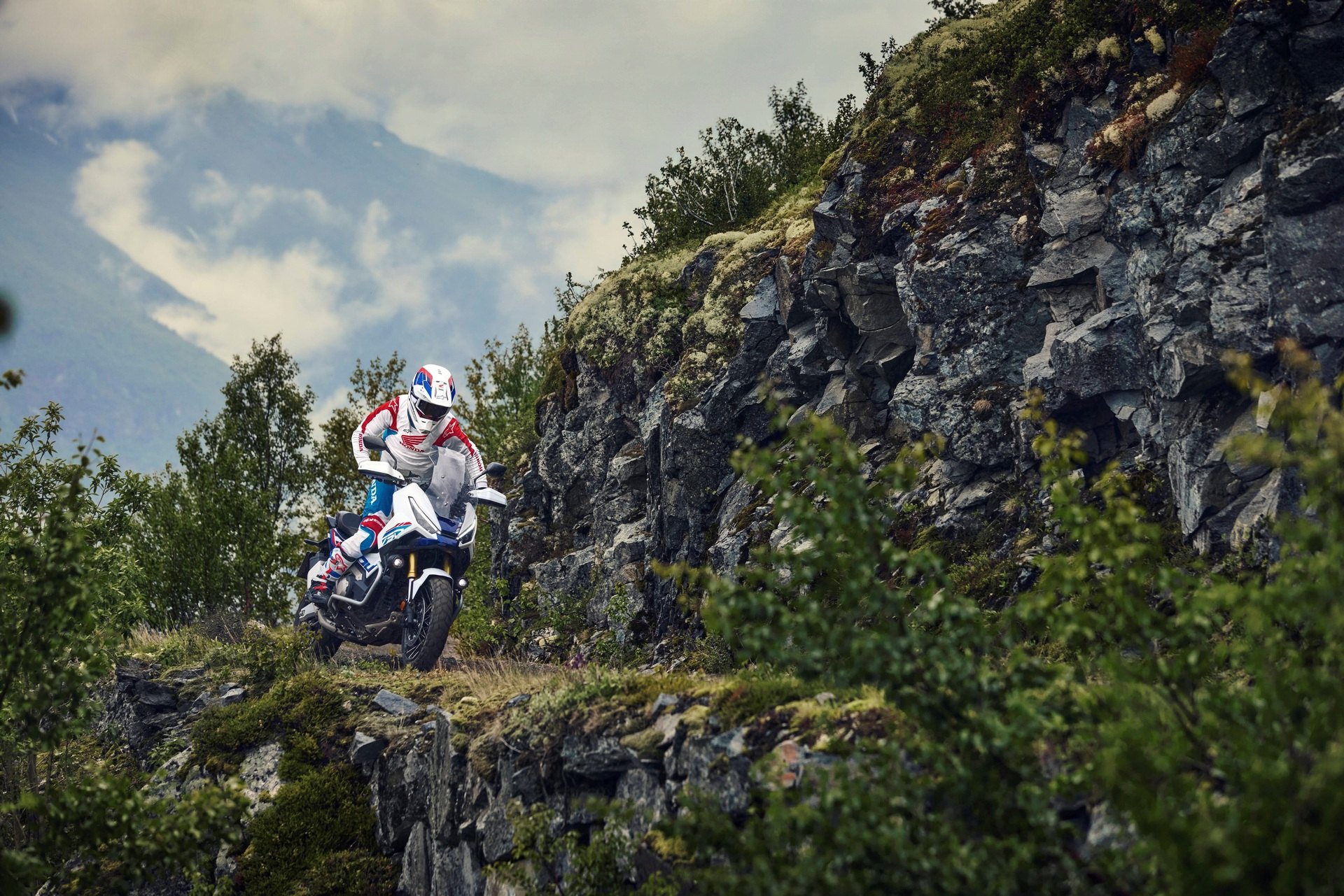 Honda X-ADV750 off road on a hillside - adventure scooter with enduro qualities