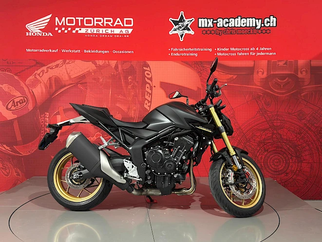 Matt black Honda CB1000 Hornet with gold rims in the Honda Motorrad Zürich showroom – category A naked bike