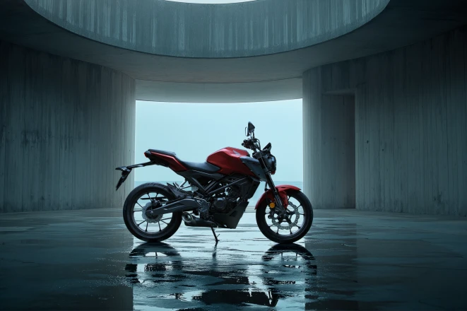 Honda CB125R in red, side view in a concrete rotunda – A1 motorcycle with 11 kW for beginners
