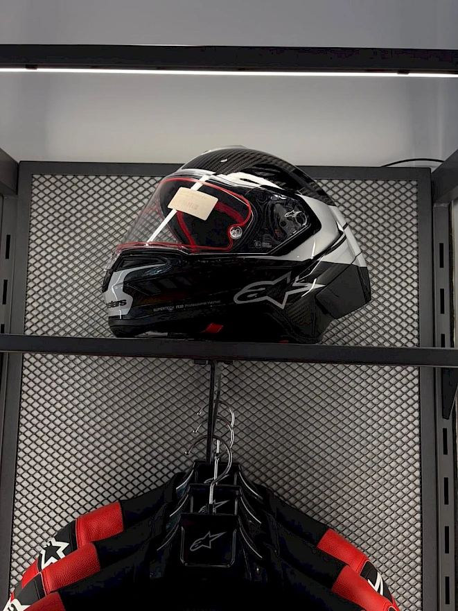 Alpinestars helmet and leather suit in the motorcycle shop in Zurich