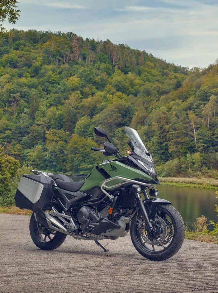 Honda NC750X with side panniers and a touring screen from the genuine accessory range